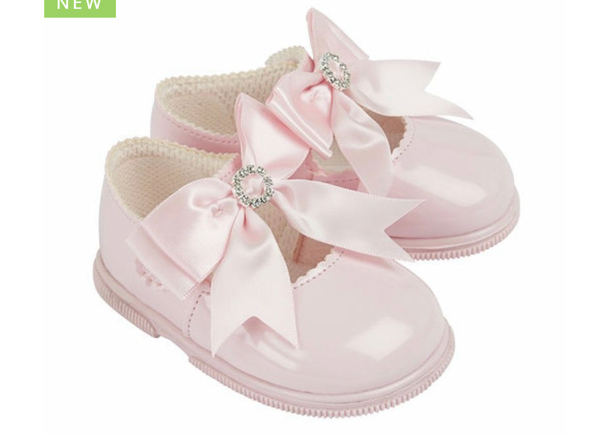 Bow and diamanté pink hard sole shoes