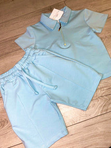 Light blue polo shirt with shorts
