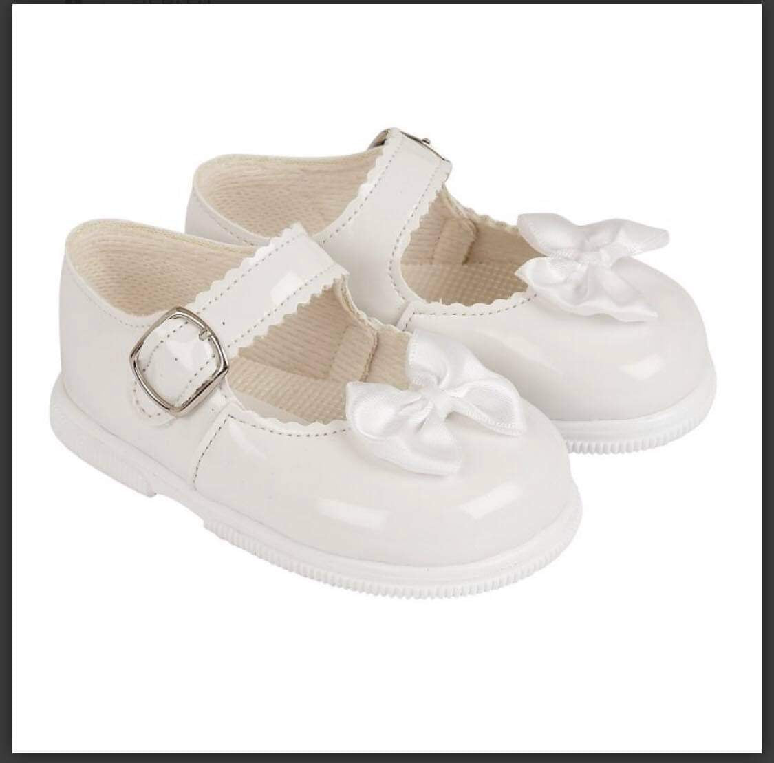 Girls hard soled bow shoes
