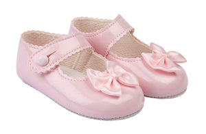 Pink soft soled bow shoes